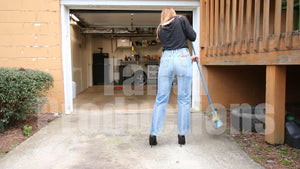 Cassandra Sweeping in High-Waisted Jeans & Stiletto Pumps