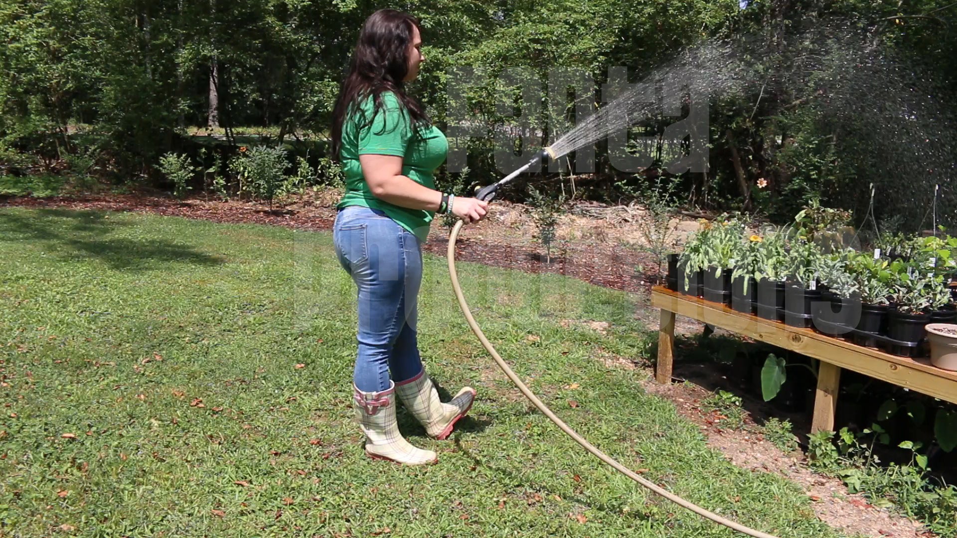 Jeanell Watering Plants in Rain Boots