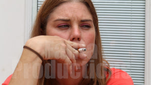Kristen Smoking in Orange Top