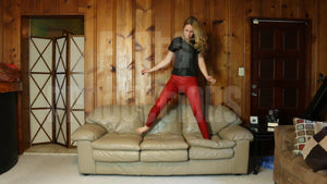 Cassandra Jumping on the Couch Barefoot in Red Leggings