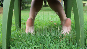 Buddah Playing in Grass Barefoot